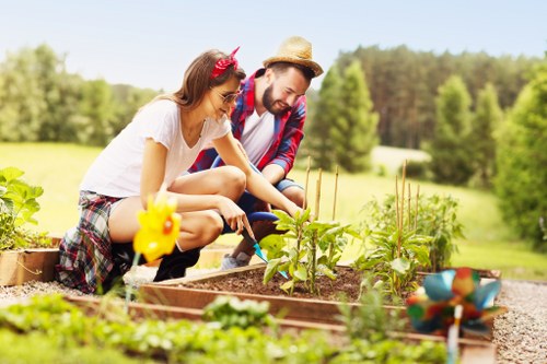 Grace Gardeners team mowing a lush green lawn