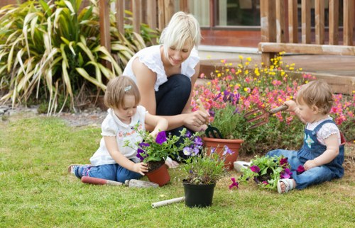 Gardener working on a vibrant garden in Wentworth Point